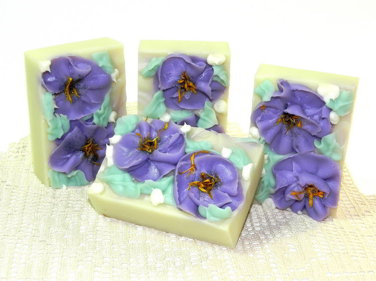 Handmade soap with piped flowers made in wooden slab soap mold